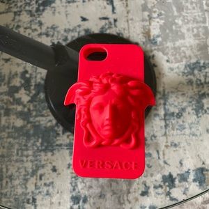 This is a red iPhone 8 Versace phone case never worn.